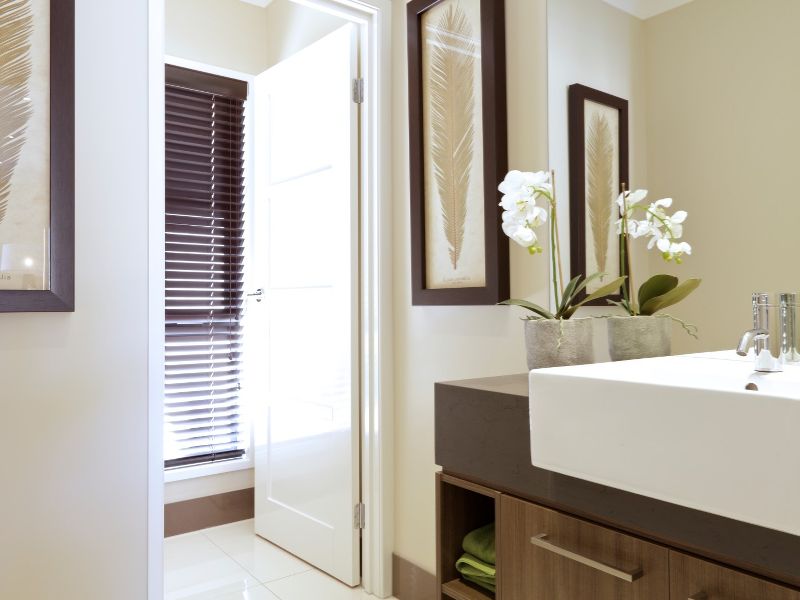 A beautiful bathroom renovation in Cairns featuring aa modern vanity and sink.